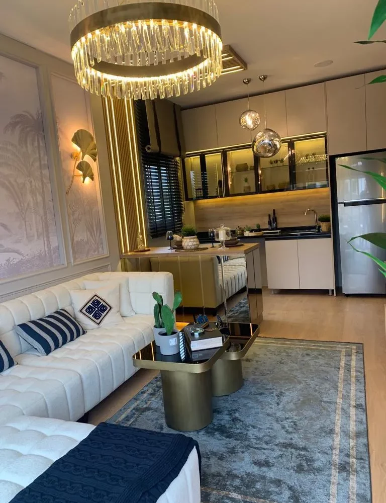 Studio apartment for sale in Mersin Kargipinari – exterior view of the residential complex with pool